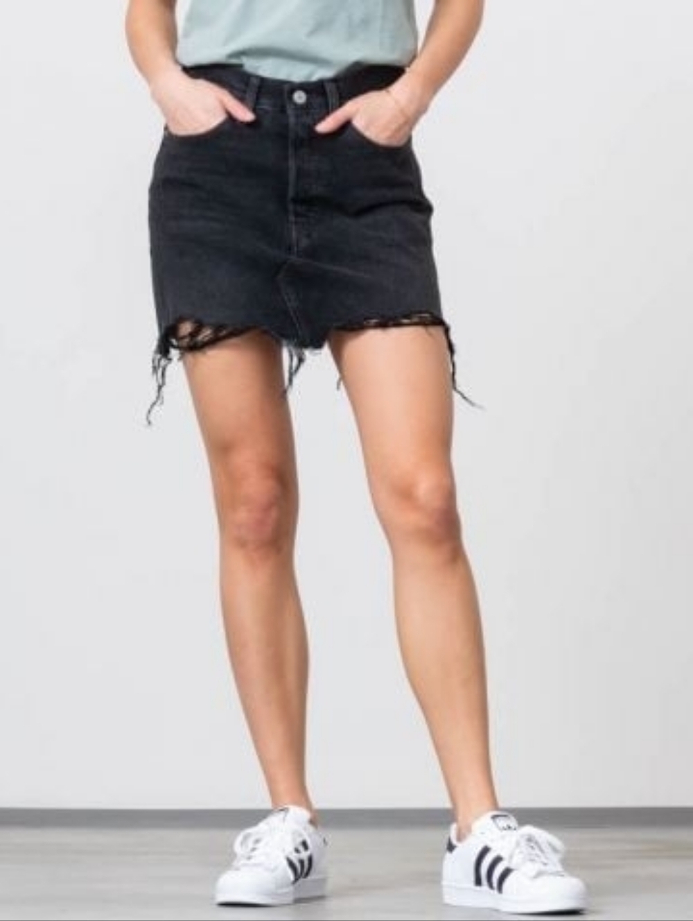 Levi's Washed Black Denim Miniskirt with Frayed Hem